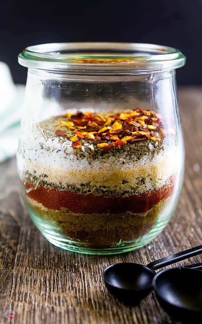 side view of clear jar with layers of spices