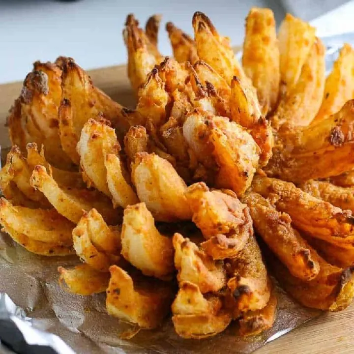 square photo of blooming onion on foil