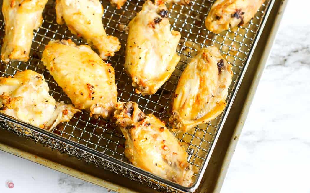 fried wings on a metal cooling rack