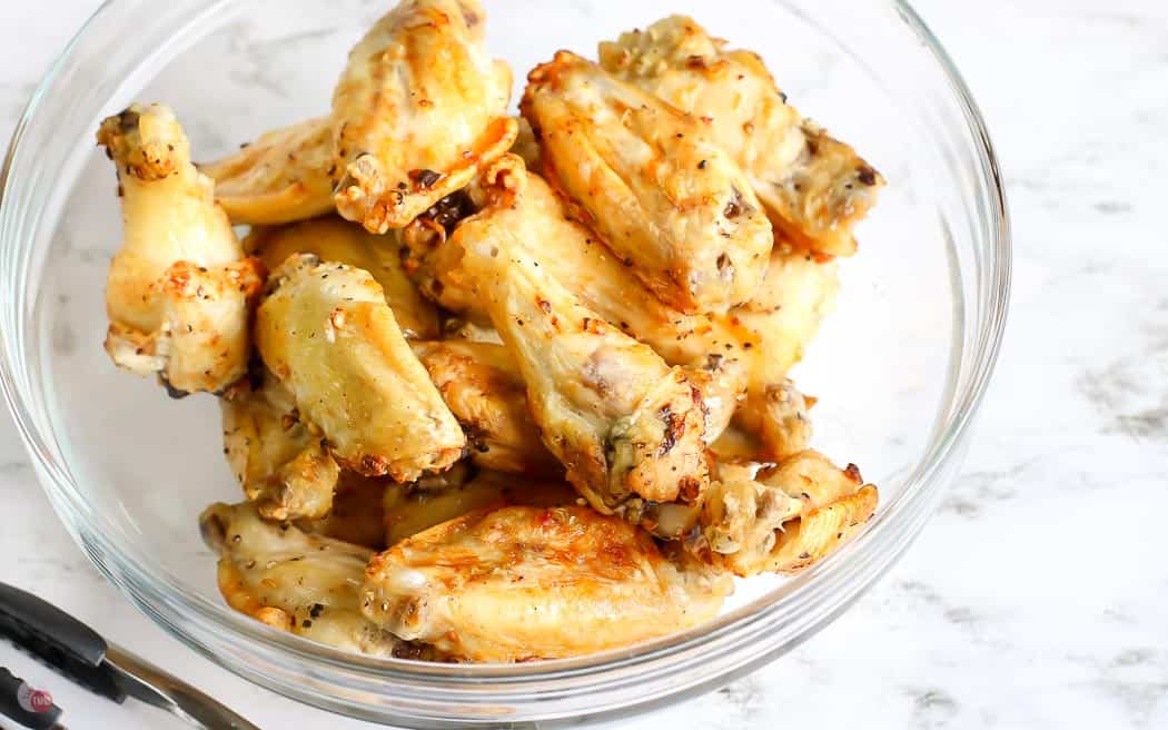 cooked wings in a clear bowl