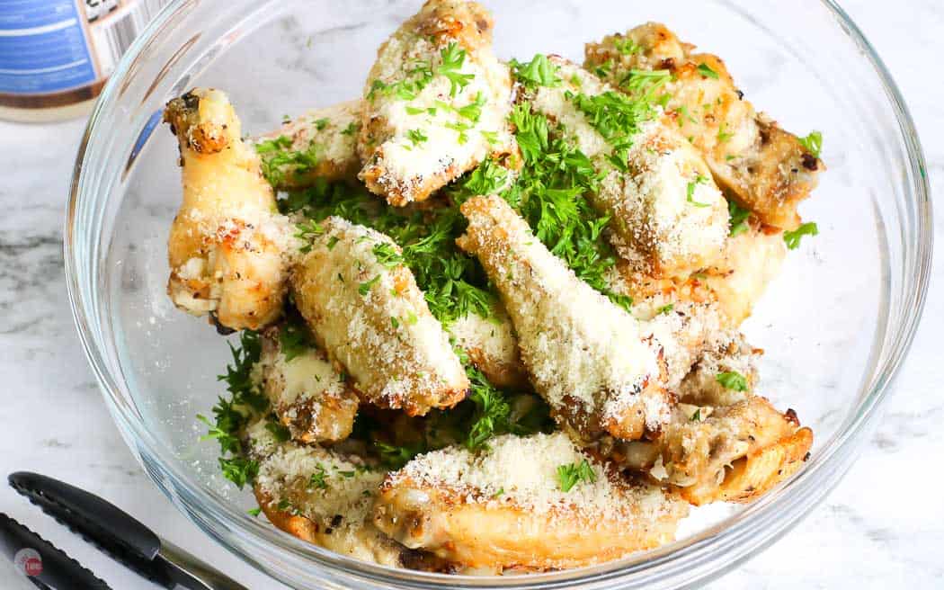 cooked chicken wings topped with grate cheese and parsley