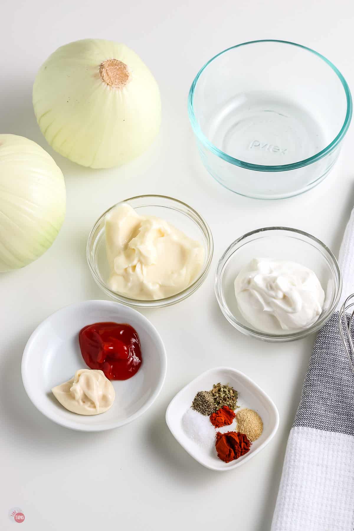 individual ingredients for sauce in clear bowls