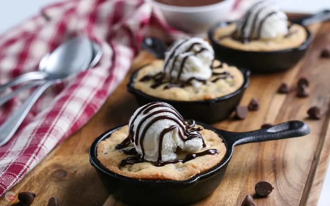 side view of pizookie skillets topped with ice cream