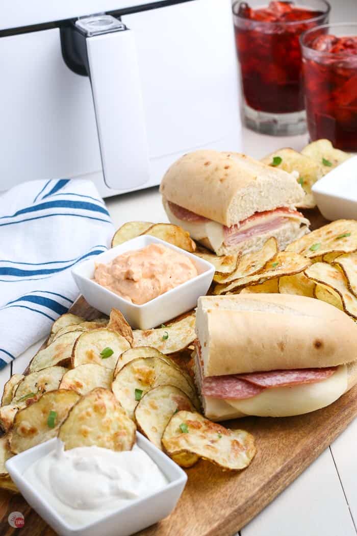 air fryer potato chips on a board with sandwiches