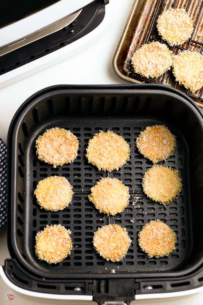 breaded zucchini slices in air fryer basket