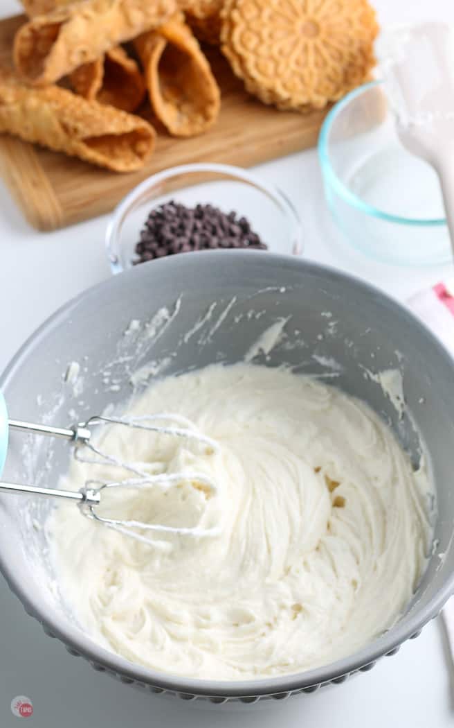 dip in a bowl with whisk