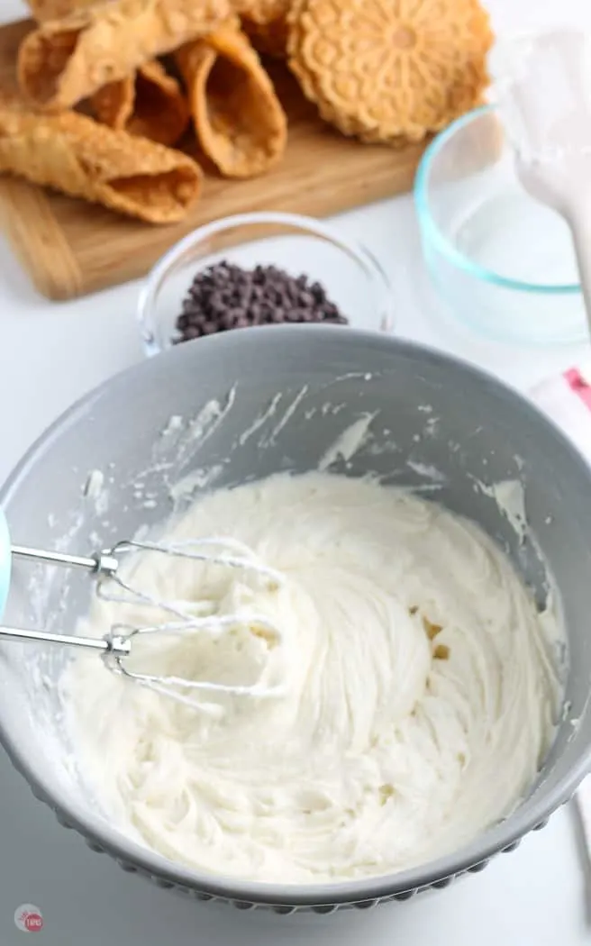 dip in a bowl with whisk