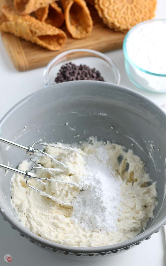 sugar and ricotta in a grey bowl