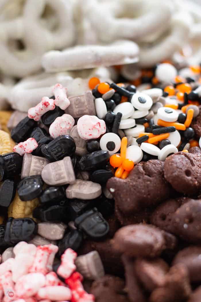 Halloween party mix ingredients in a clear bowl