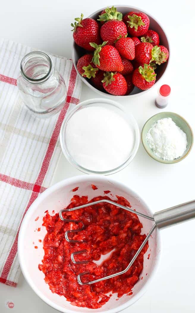 strawberries mashed in a white bowl