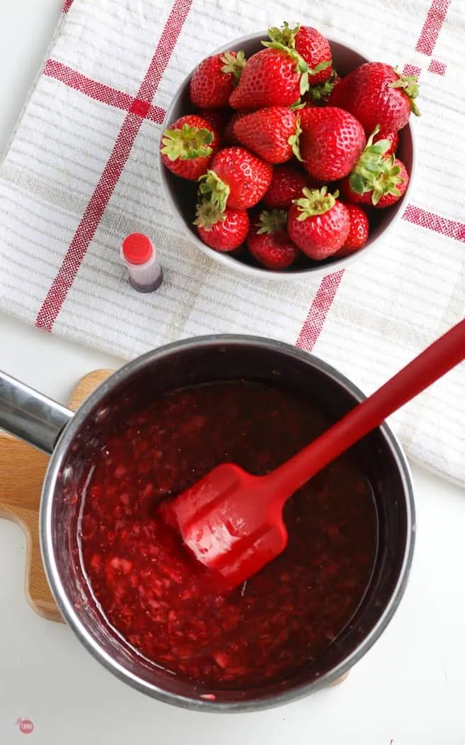 strawberry sauce in a pot with red spatula