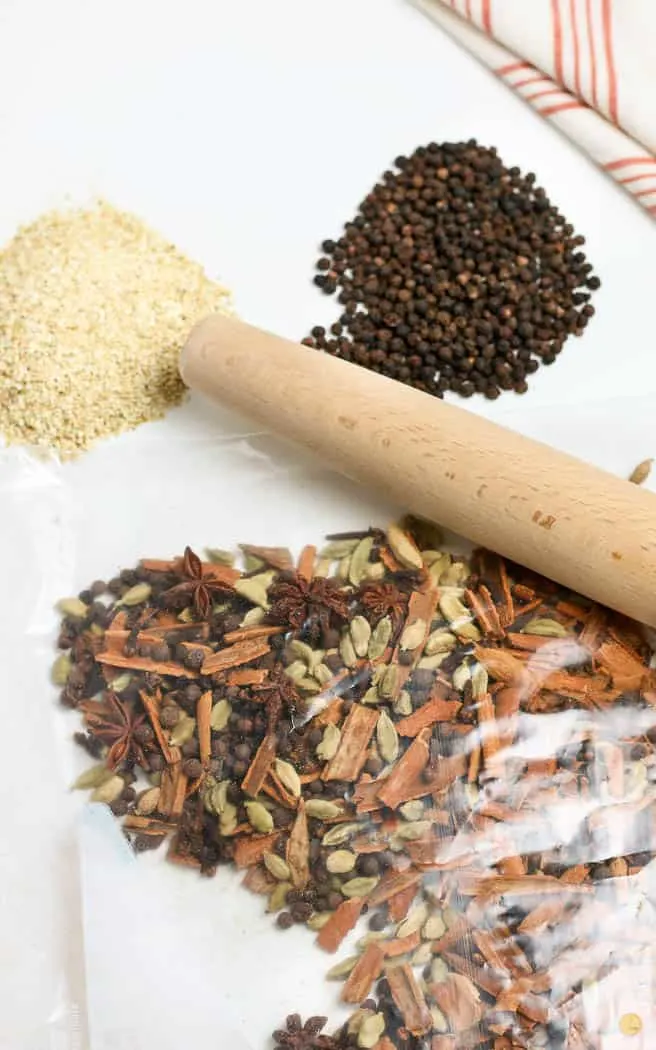 spices in a bag with a rolling pin