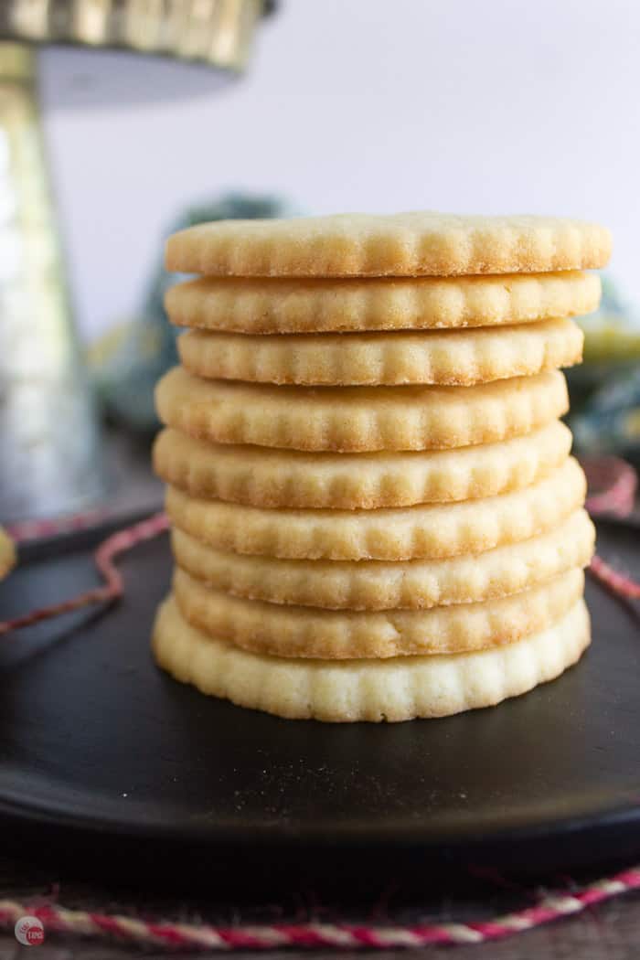 stack of almond cookies on black plate