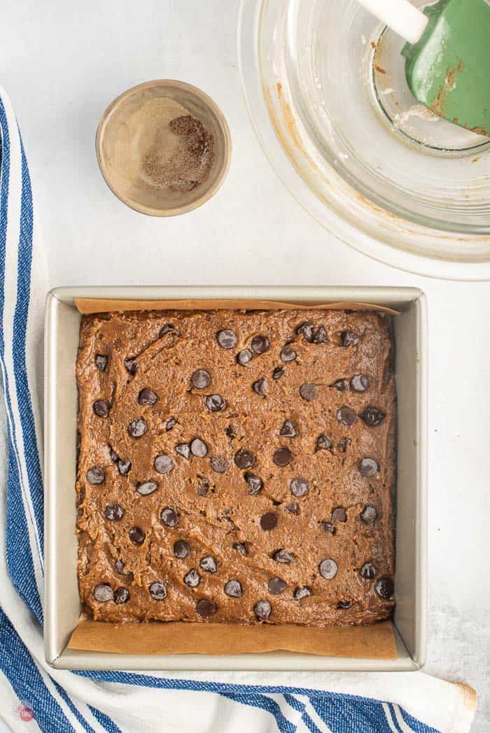 raw brownie batter in a pan