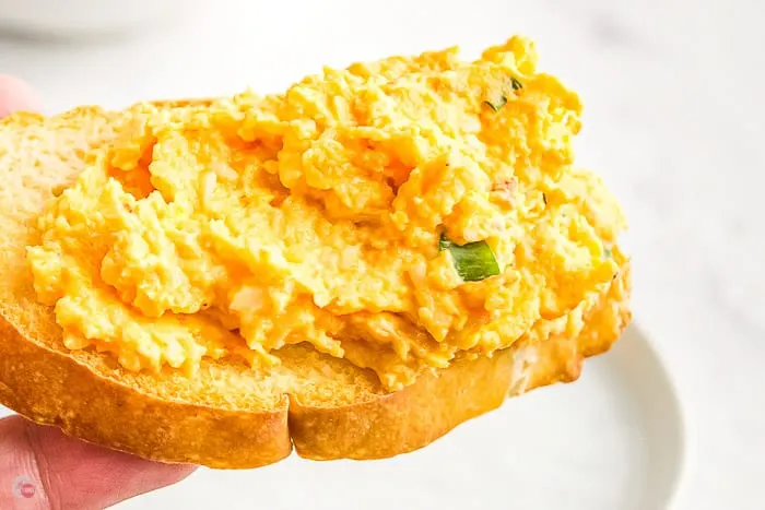 close up of cracker with pimento spread
