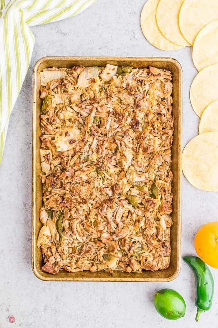 overhead picture of a sheet pan of shredded meat