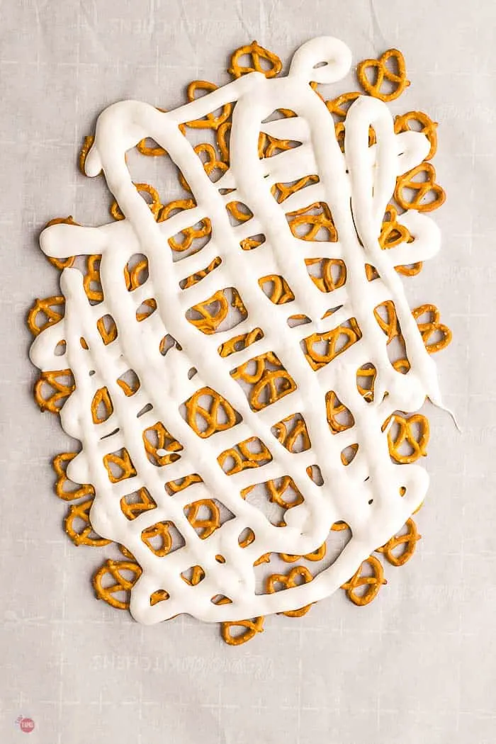 pretzels and marshmallow on parchment paper