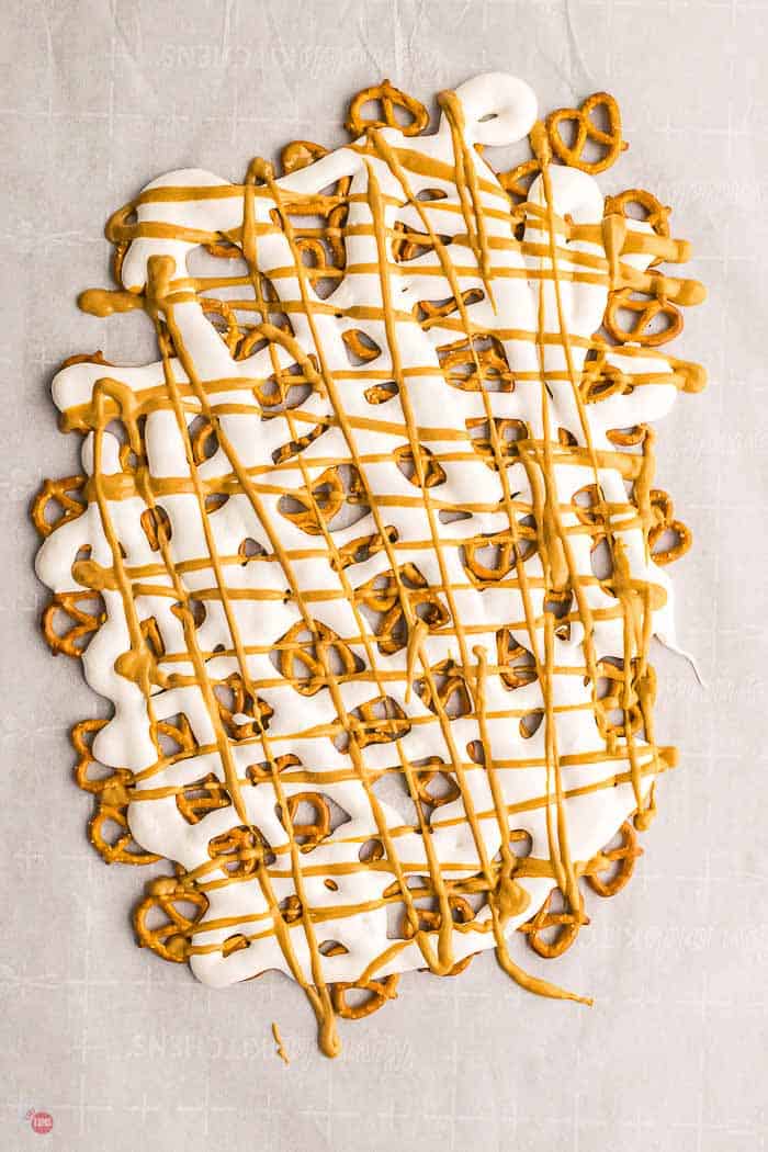 pretzels, marshmallow, and peanut butter on parchment paper