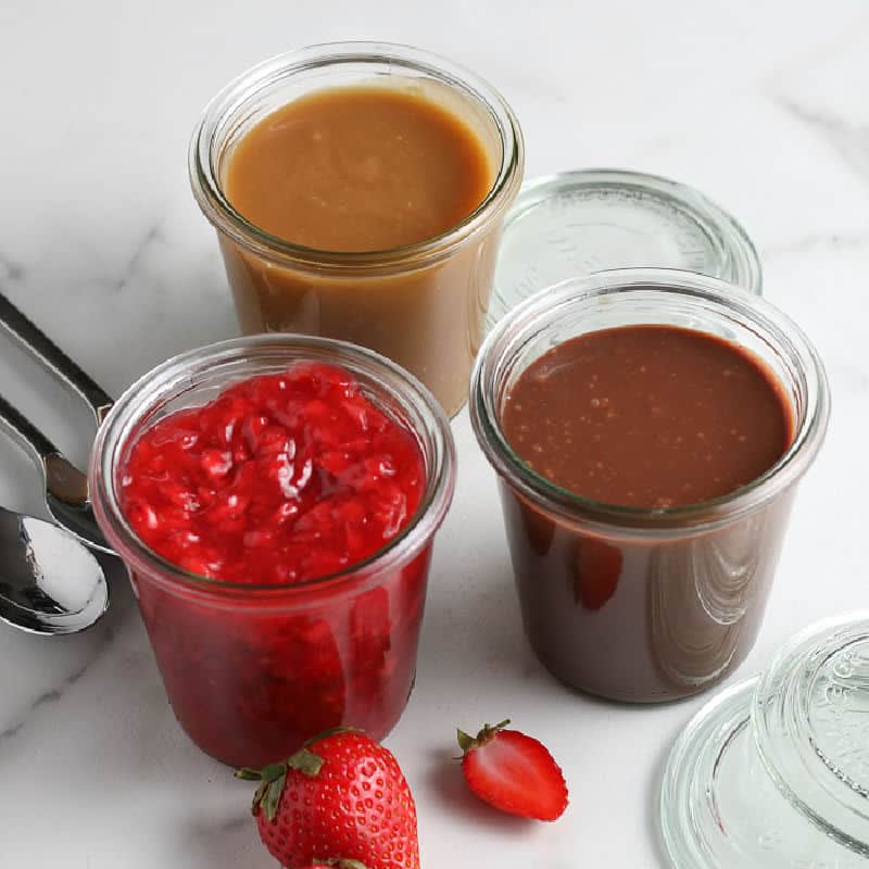 square picture of three jars of sauce