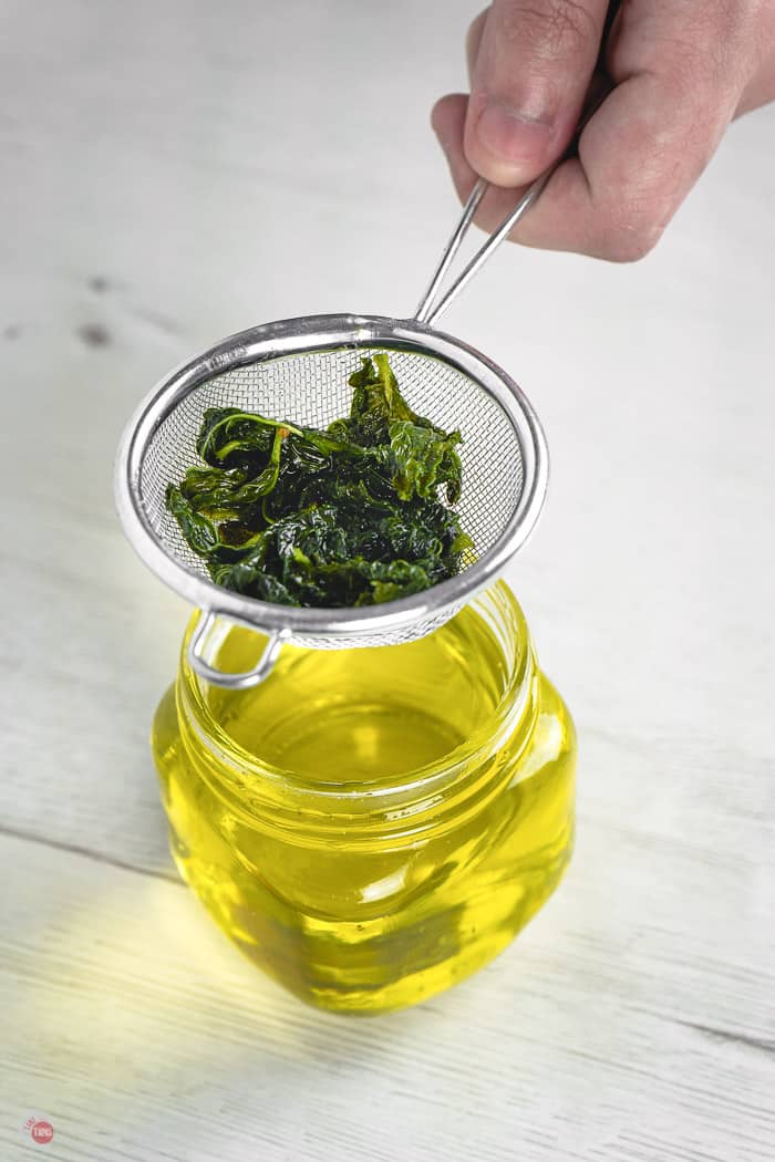 sieve of mint over a jar