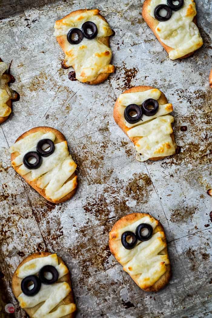 baked naan mummies on a baking sheet