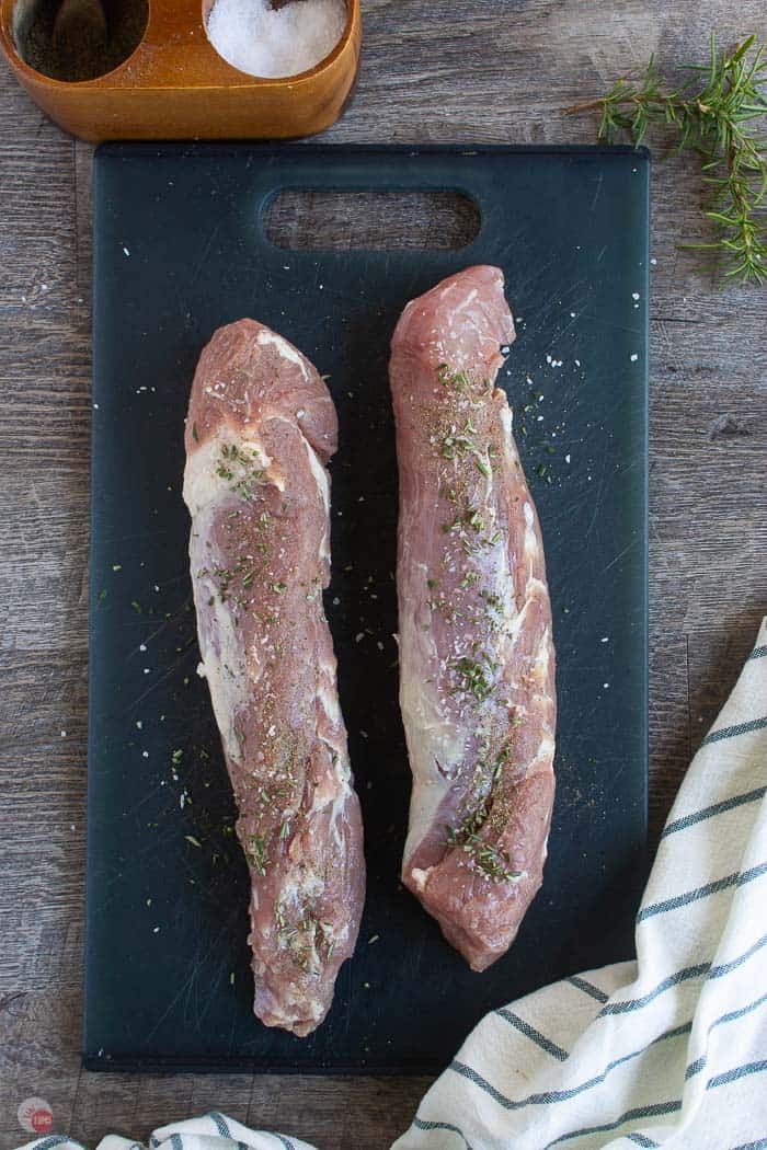 seasoned pork tenderloins on a cutting board