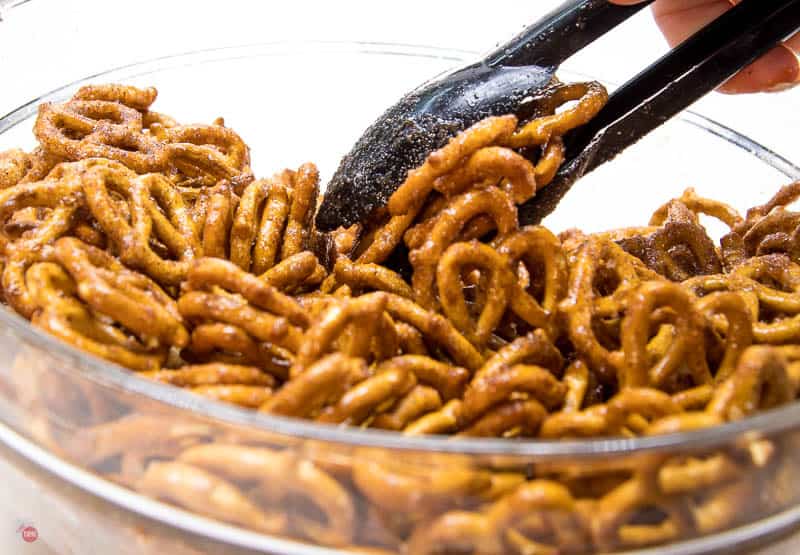 pretzels in a bowl with tongs