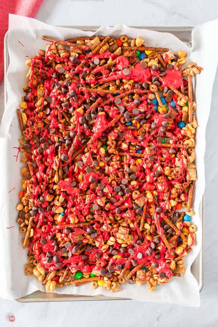 candy coated snack mix on baking sheet