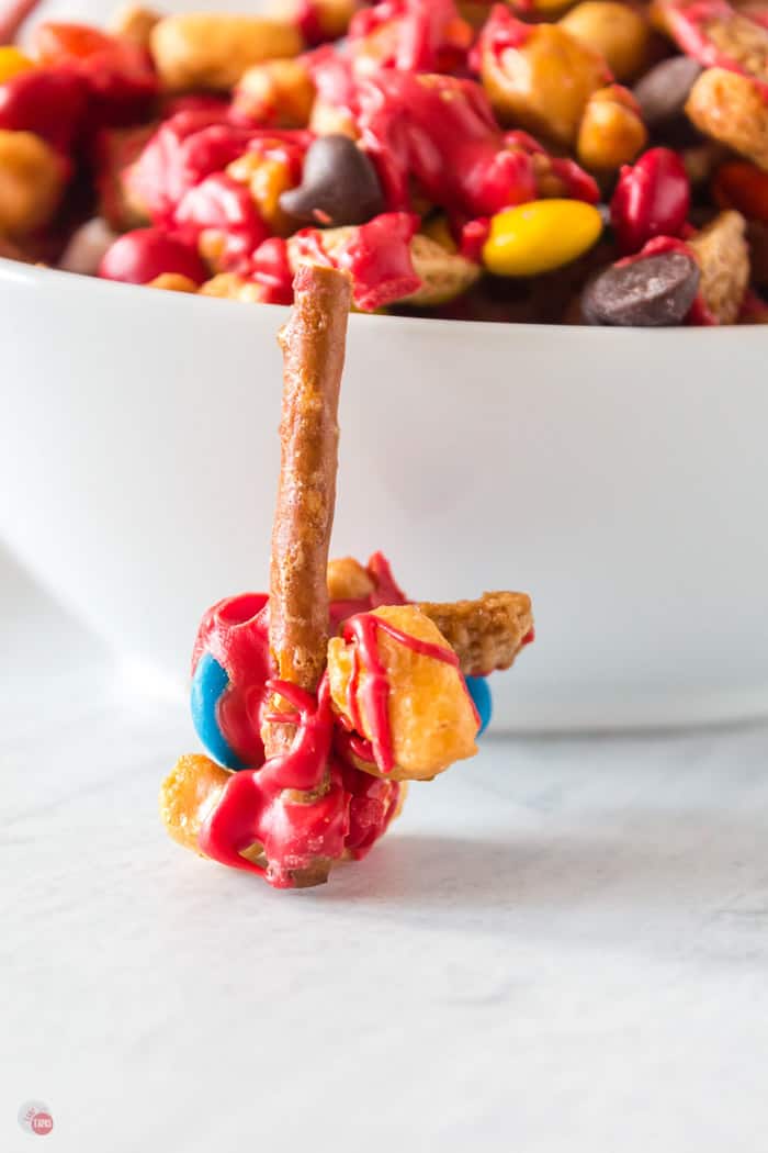 pretzel snack mix in front of white bowl
