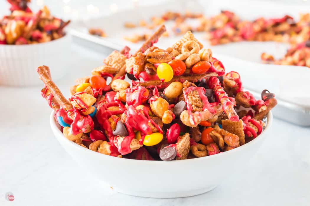 christmas chex mix in a white bowl
