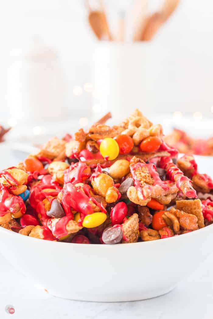 elf snack christmas chex mix in a white bowl