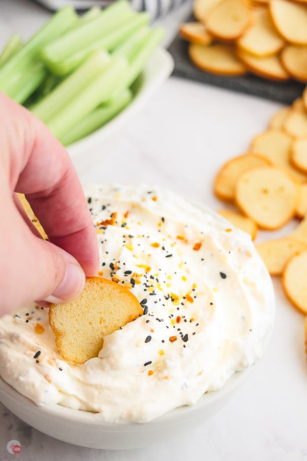 dip in a bowl with bagel chip
