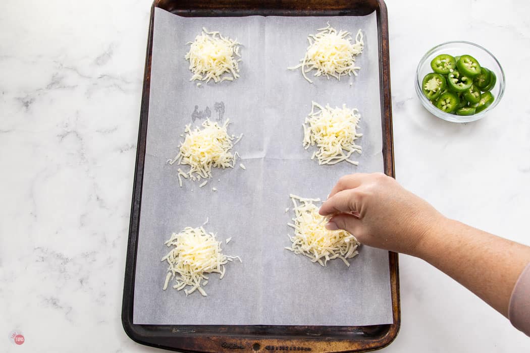 piles of cheese on baking sheet