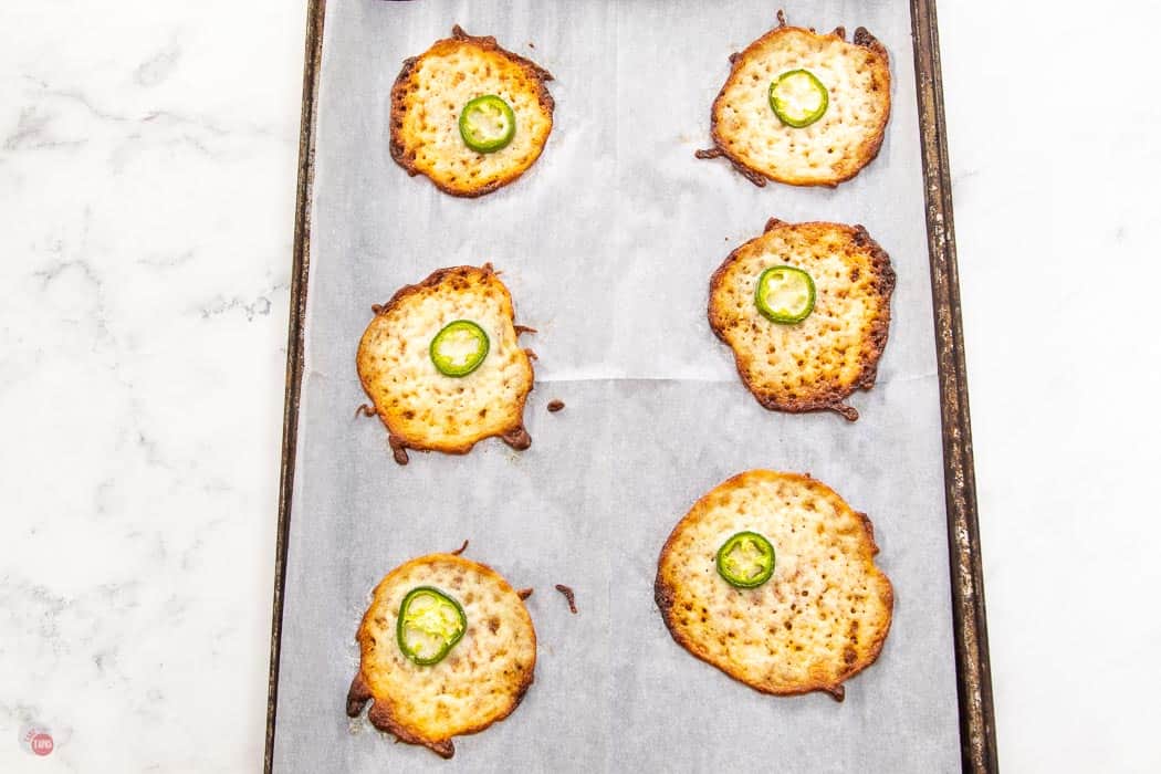 baked cheese crisps on cookie sheet