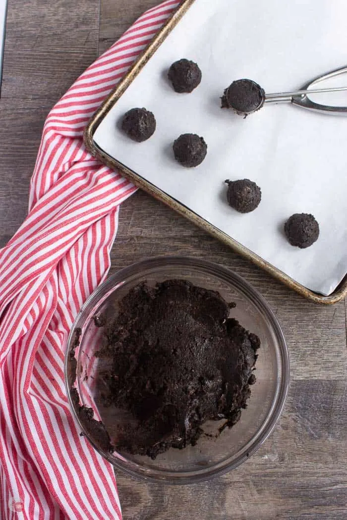 dough scooped into balls on baking sheet