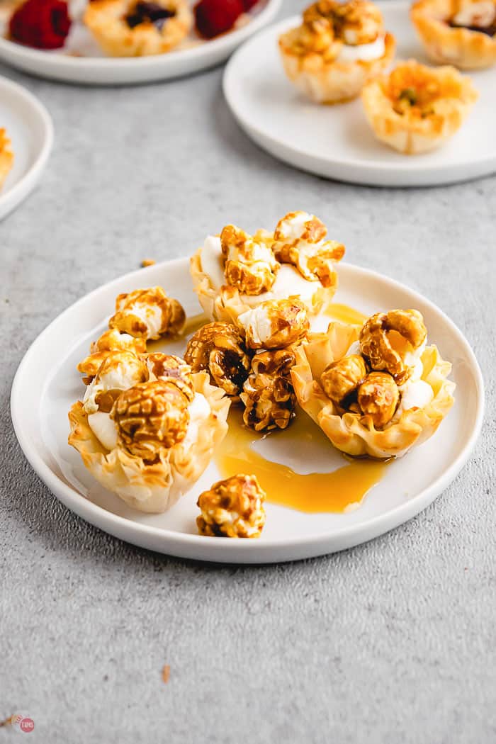 phyllo cups with caramel on white plate