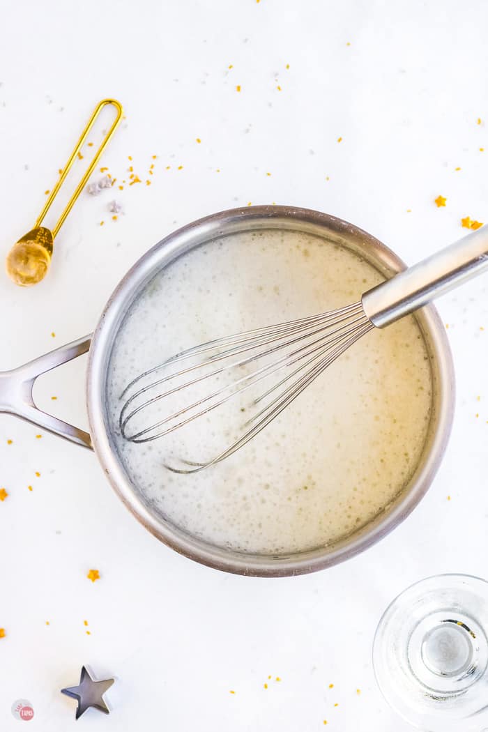 overhead pic of gelatin in a pot with a whisk