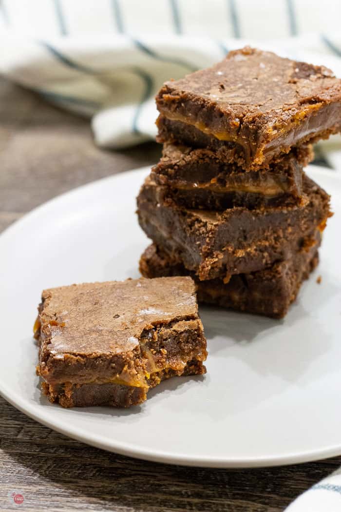 side view of stack of brownies on a plate