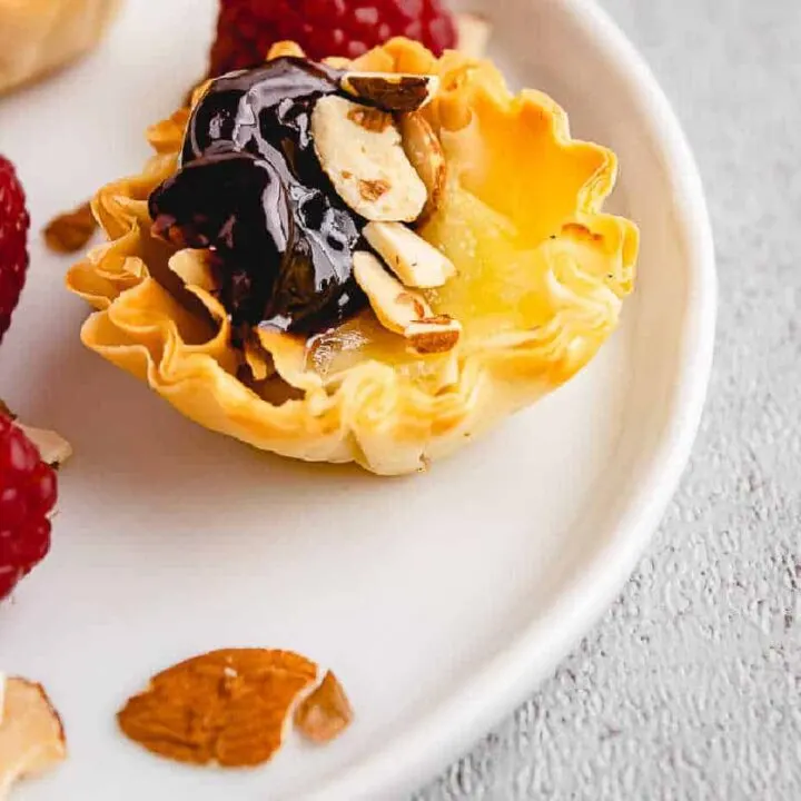 phyllo cup on white plate with almonds