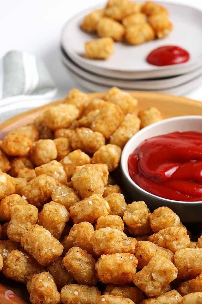 close up of tater tots on platter