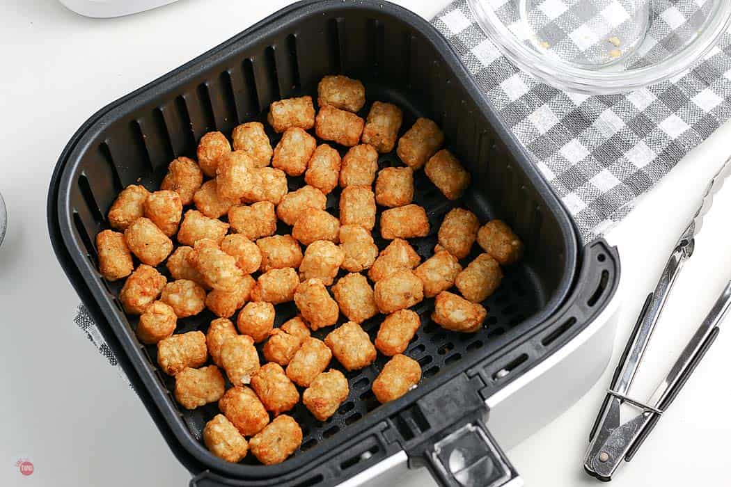 cooked tater tots in a basket