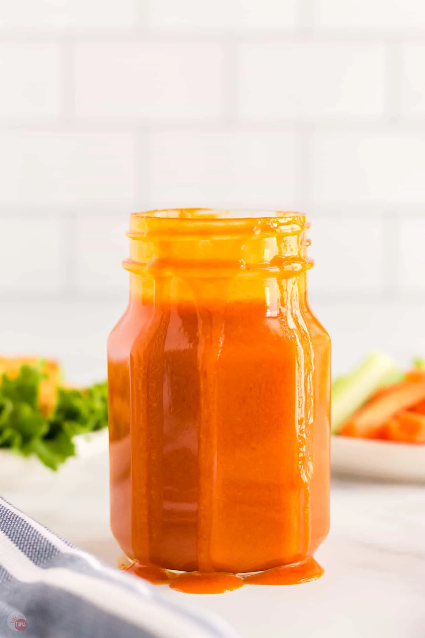 side view of jar of buffalo wing sauce