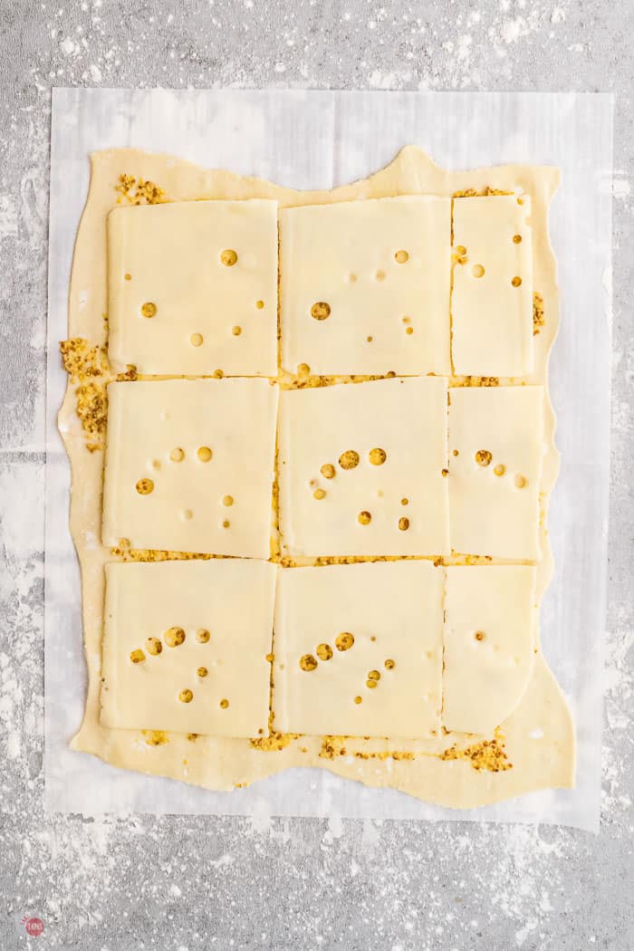 cheese and mustard on puff pastry