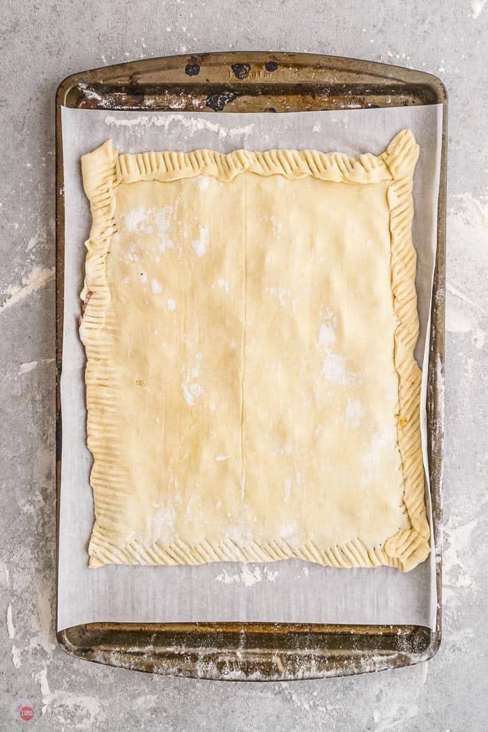 sealed pastry on baking sheet