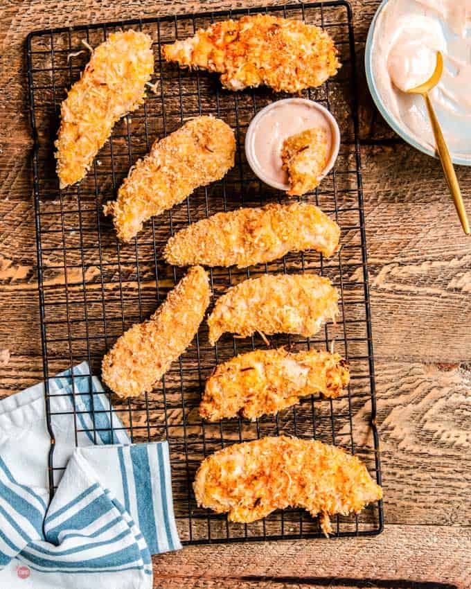 coconut chicken tenders on a cooling rack