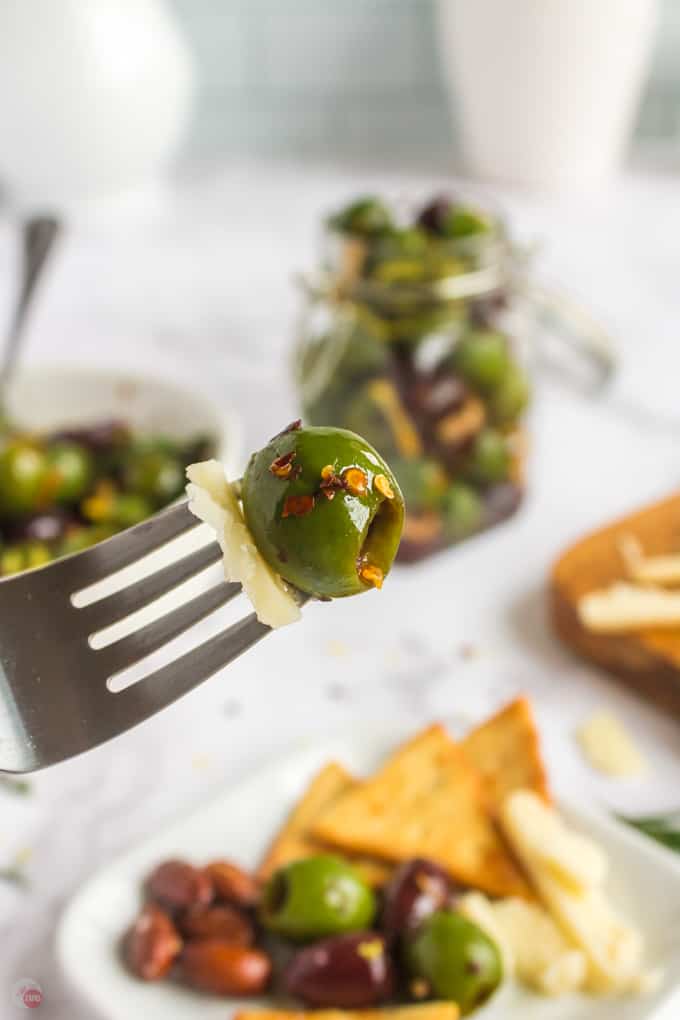 fork with cheese and olive