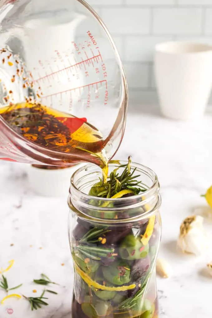 pouring oil into jar