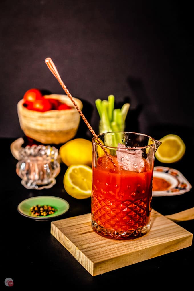 Bloody Mary Cocktail in glasses with garnishes. Tomato Bloody Mary spicy  drink on black stone background with copy space Stock Photo - Alamy