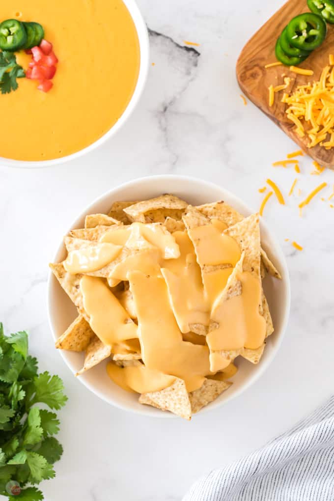 bowl of chips and cheese sauce