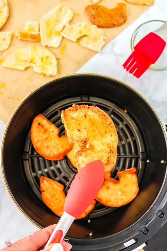 tongs holding a chip